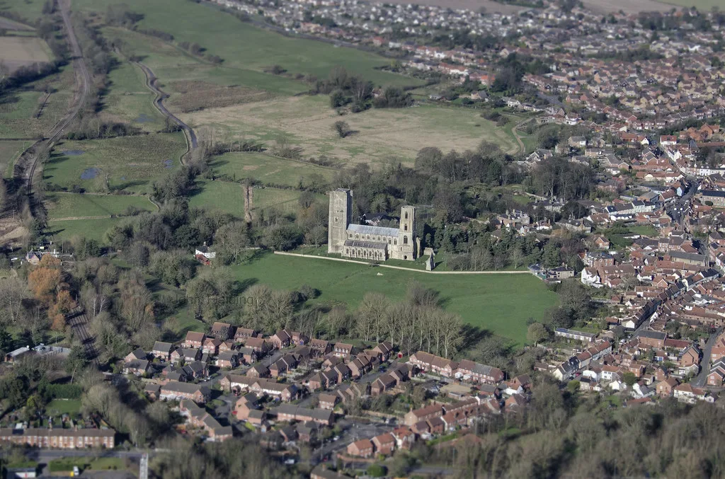 Wymondham from the air, with the Abbey between the town and open farmland. The photograph does not show any of the sites in the register